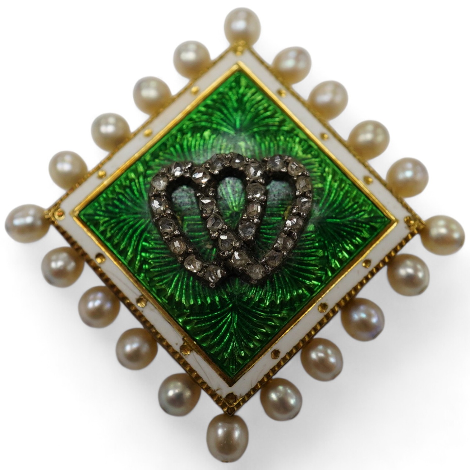 An Edwardian yellow metal, enamel, seed pearl and rose cut diamond chip set brooch, with entwined hearts motif, 29mm, gross weight 7.3 grams. Condition - good